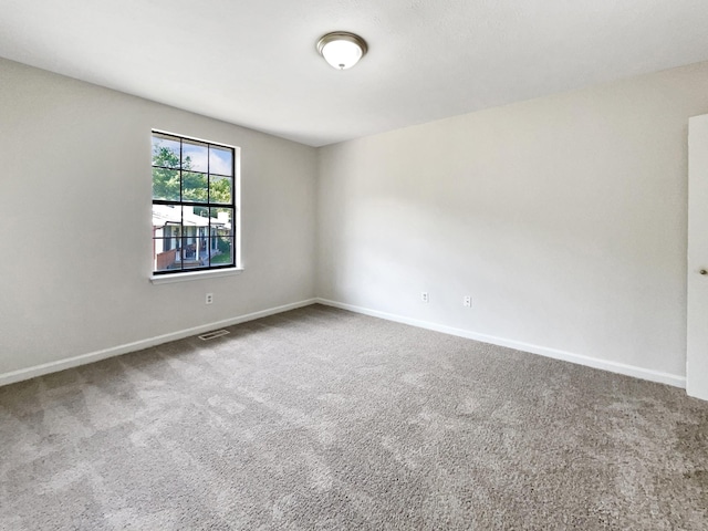 unfurnished room with carpet