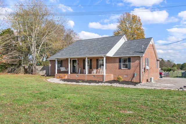 view of front of home with a porch and a front yard