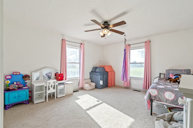 bedroom with light colored carpet and ceiling fan