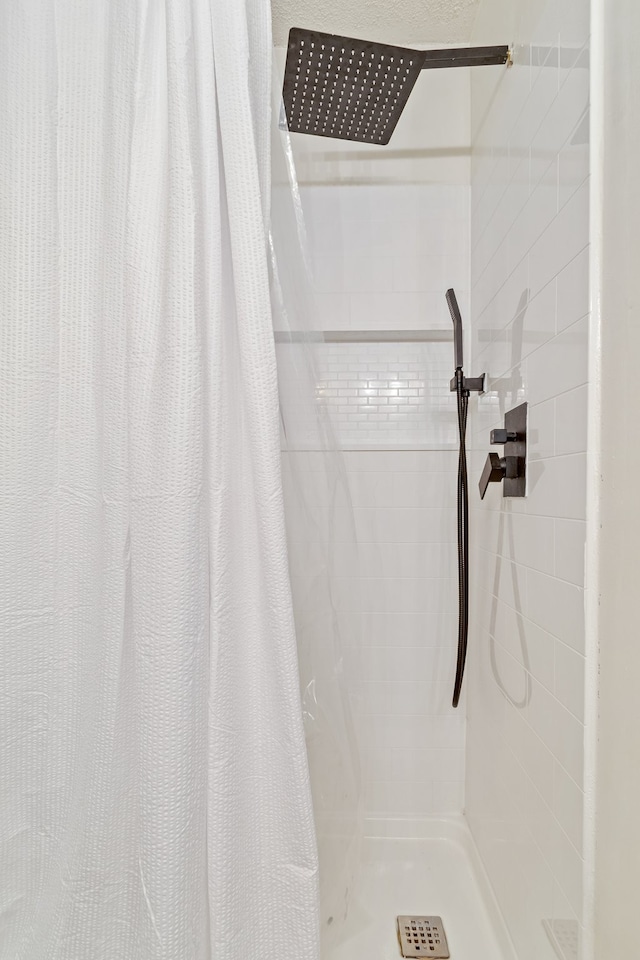 bathroom with a shower with shower curtain