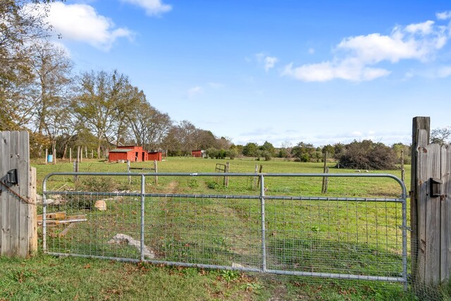 view of yard with a rural view