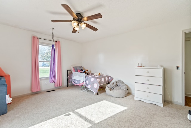 carpeted bedroom featuring ceiling fan