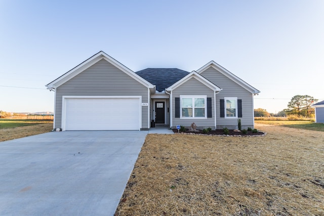 single story home with a garage