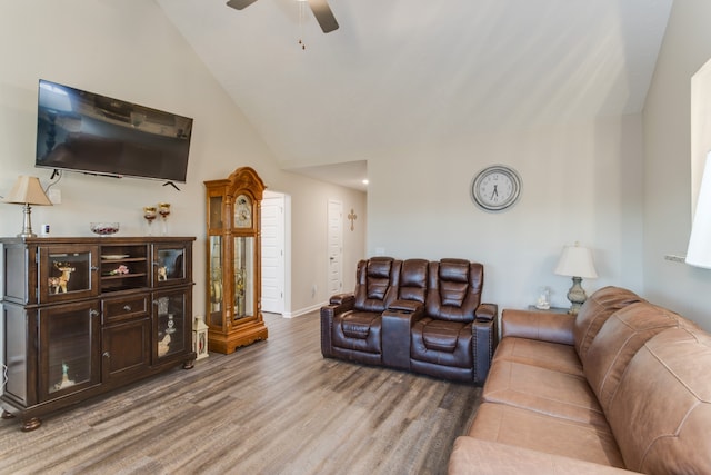 living room featuring ceiling fan, high vaulted ceiling, and wood-type flooring