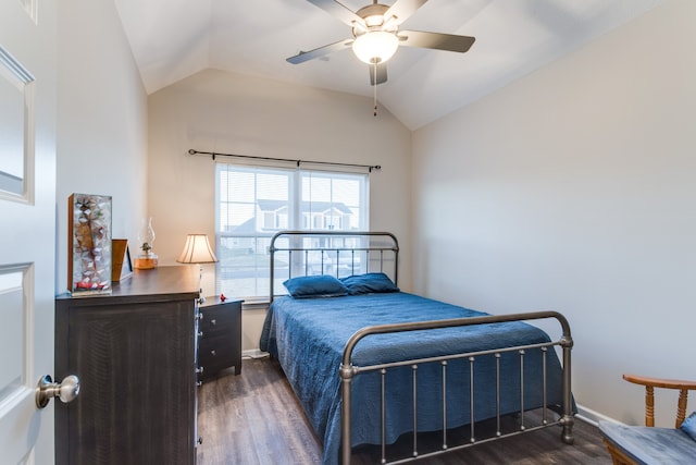 bedroom featuring lofted ceiling, dark wood-type flooring, and ceiling fan