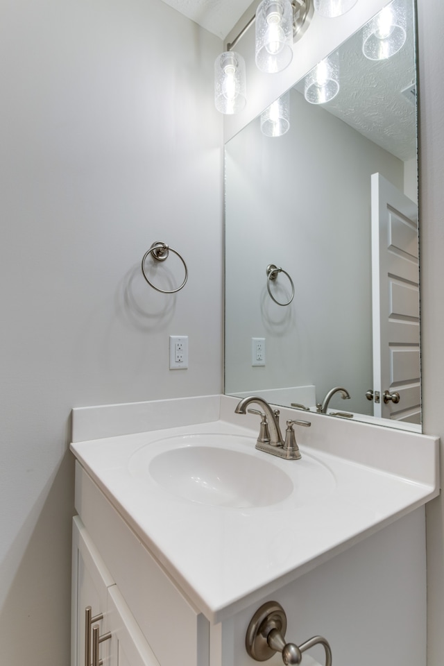 bathroom featuring vanity and a textured ceiling