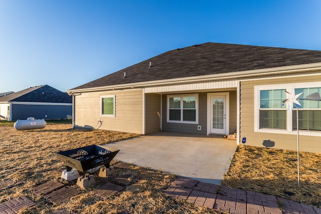 back of house with a patio area