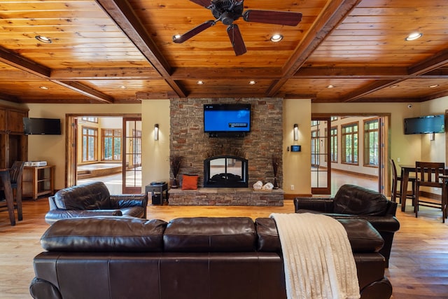 living room with light wood-type flooring, a wealth of natural light, and wooden ceiling