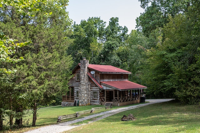 view of front of home with a porch and a front yard