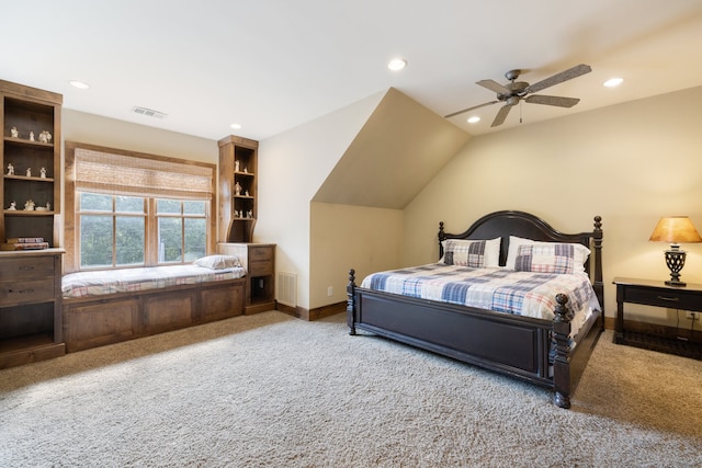 bedroom featuring ceiling fan, light colored carpet, and lofted ceiling