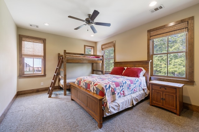 bedroom with light carpet and ceiling fan