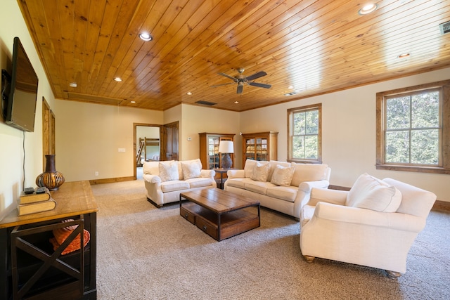 carpeted living room with ceiling fan and wooden ceiling