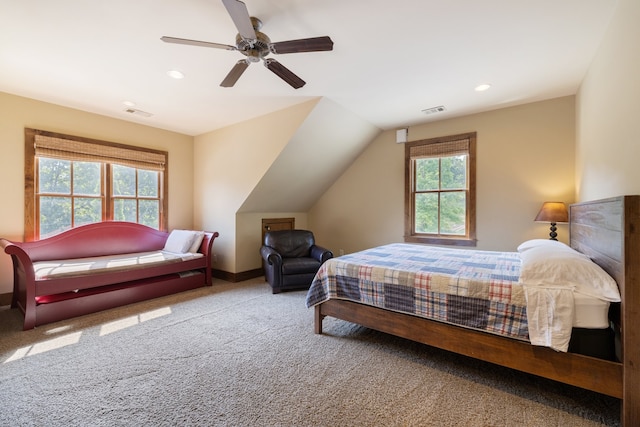 carpeted bedroom featuring ceiling fan and lofted ceiling