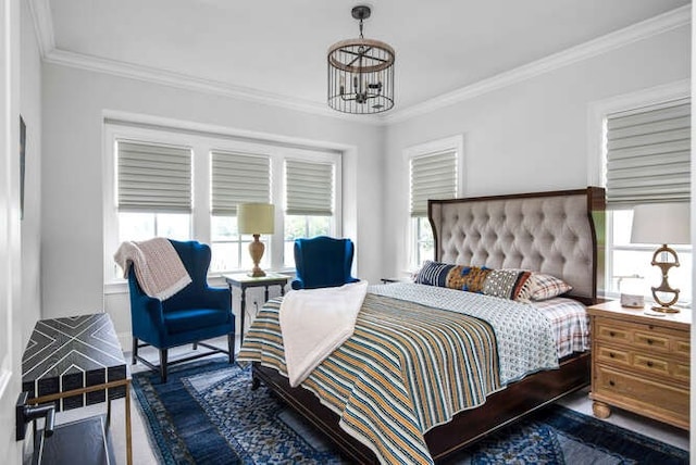 bedroom featuring crown molding, dark wood-type flooring, and a chandelier