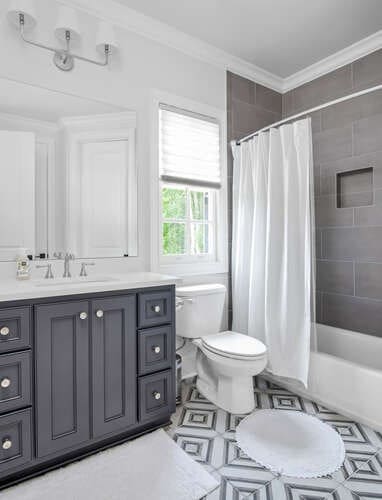 full bathroom featuring toilet, crown molding, shower / tub combo with curtain, and vanity