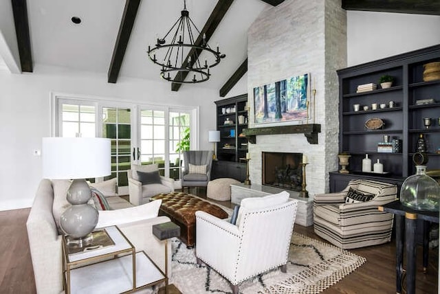 living room with dark hardwood / wood-style flooring, an inviting chandelier, high vaulted ceiling, beamed ceiling, and a fireplace