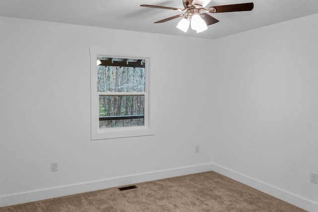 empty room with carpet flooring and ceiling fan