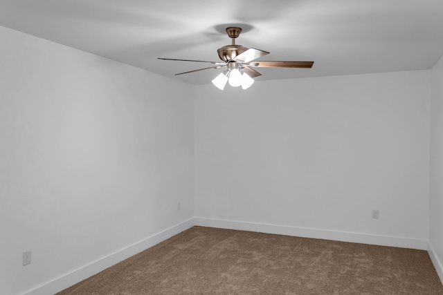 empty room with ceiling fan and carpet floors