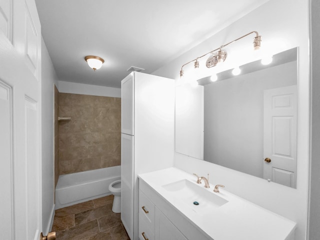 full bathroom featuring vanity, toilet, and tiled shower / bath