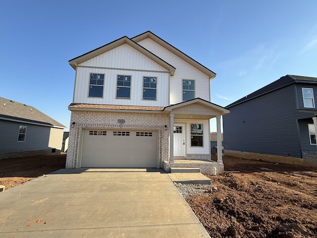 view of front of property featuring a garage and a porch