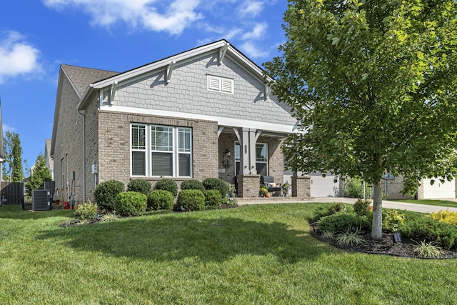 view of front facade featuring a garage, central AC unit, and a front lawn