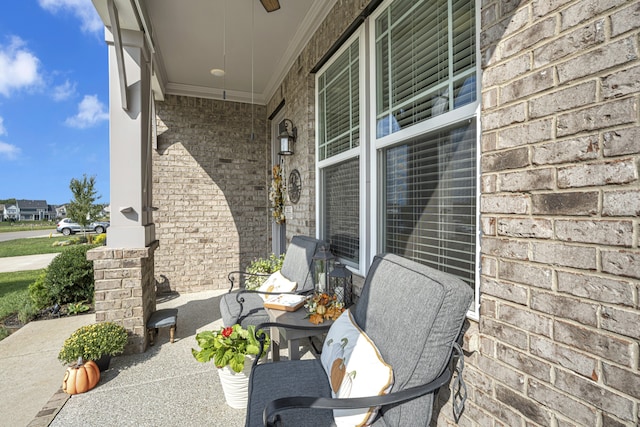 view of patio featuring ceiling fan and covered porch