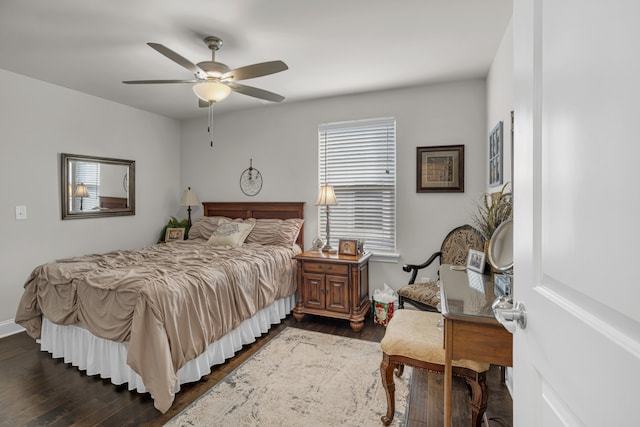 bedroom with dark wood-type flooring and ceiling fan