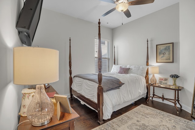 bedroom with dark hardwood / wood-style floors and ceiling fan