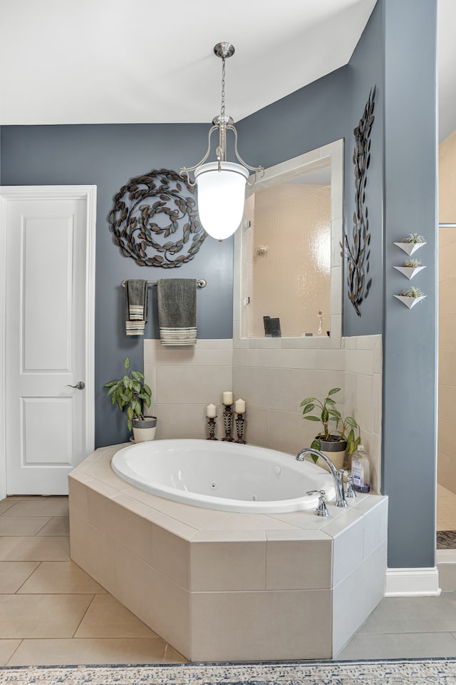 bathroom with separate shower and tub and tile patterned floors