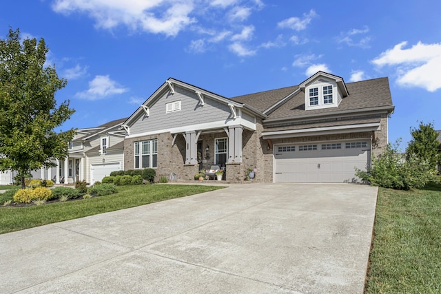 view of front of home with a garage and a front yard