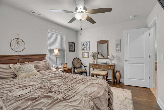 bedroom featuring dark wood-type flooring and ceiling fan