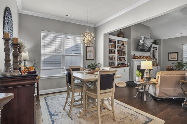 dining room featuring crown molding and dark hardwood / wood-style floors