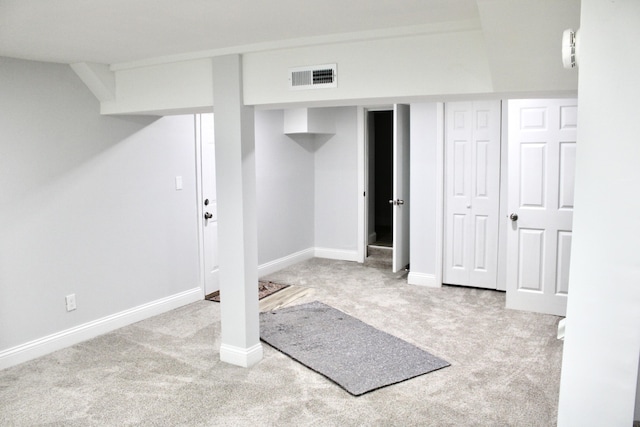 basement with light colored carpet