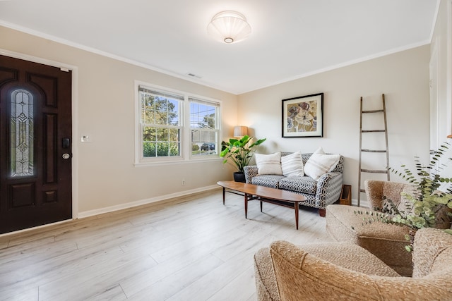 living room featuring ornamental molding and light wood-type flooring