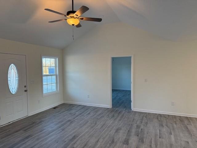 entryway with ceiling fan, dark hardwood / wood-style flooring, and vaulted ceiling