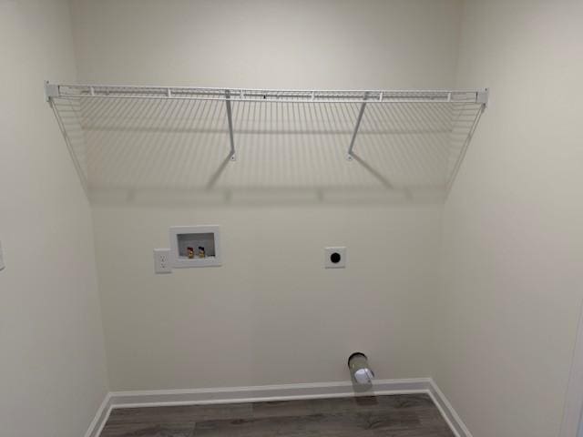 laundry area with electric dryer hookup, dark wood-type flooring, and washer hookup