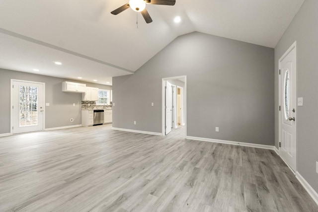 unfurnished living room with light hardwood / wood-style floors, ceiling fan, and lofted ceiling