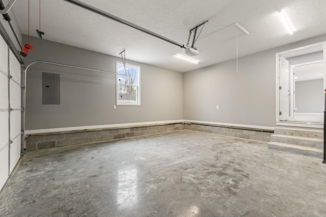 garage featuring a garage door opener and electric panel