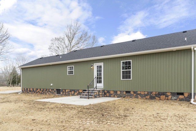 back of property with a patio