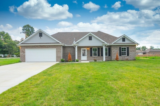 view of front of property with a garage and a front lawn