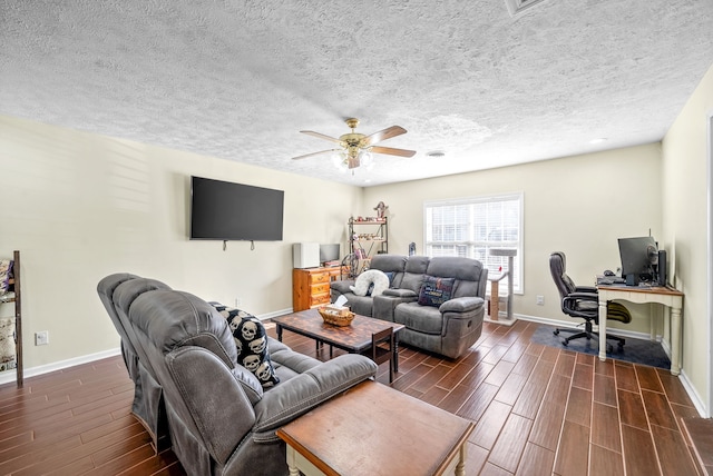 living room with dark hardwood / wood-style floors, a textured ceiling, and ceiling fan