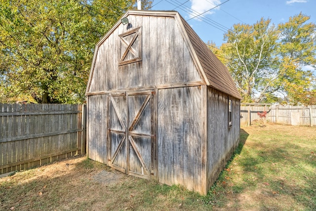 view of outbuilding featuring a lawn