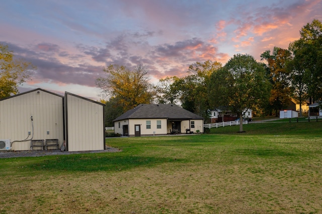 yard at dusk with ac unit