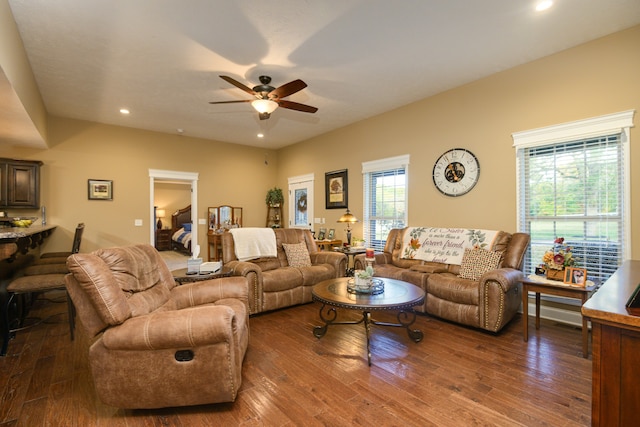 living room featuring dark hardwood / wood-style floors and ceiling fan