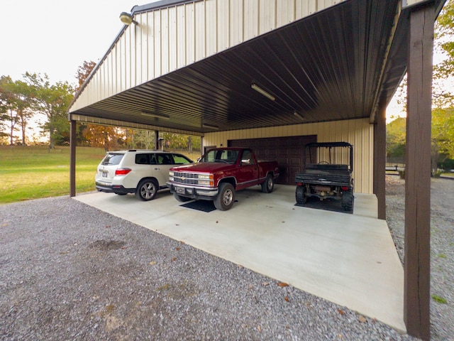 view of vehicle parking featuring a yard and a carport