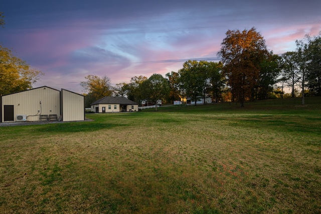 view of yard at dusk