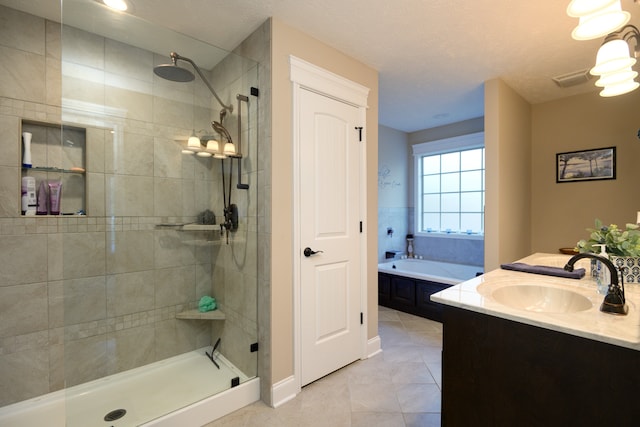 bathroom with vanity, tile patterned floors, a textured ceiling, and separate shower and tub