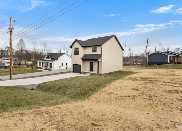 exterior space with a garage and a yard