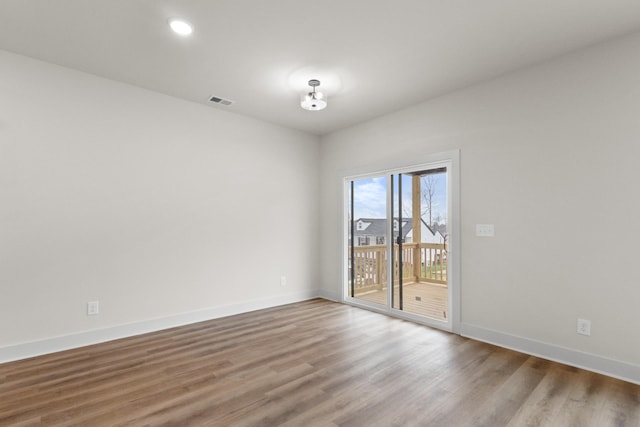 empty room featuring hardwood / wood-style flooring