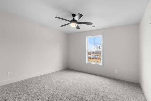 carpeted empty room with ceiling fan